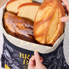 Beeswax lined bread bag storing fresh homemade loaves to keep bread fresher for longer