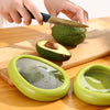 Reusable avocado saver container storing half an avocado to prevent browning and reduce food waste