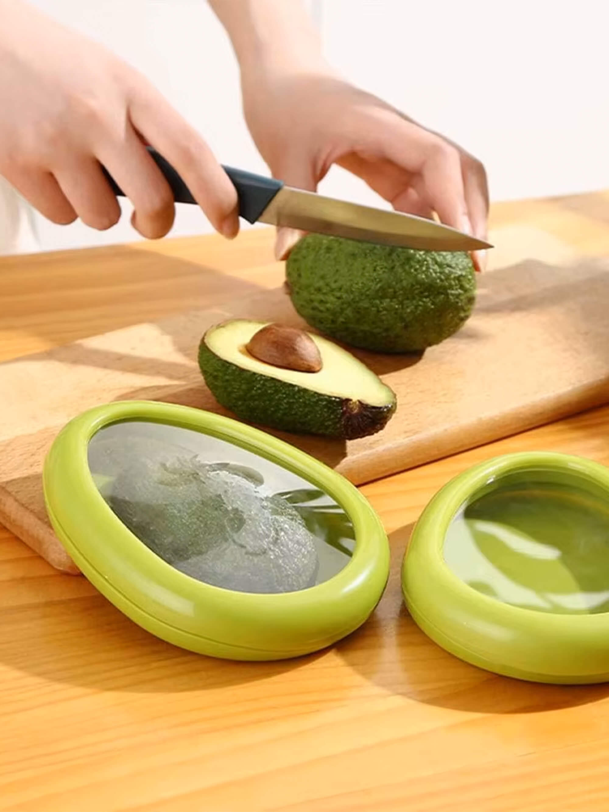 Reusable avocado saver container storing half an avocado to prevent browning and reduce food waste