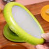 Reusable silicone avocado saver container storing half avocado with flexible lid seal