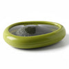 Reusable silicone avocado saver container storing half avocado with flexible seal lid on white background