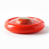 Reusable silicone tomato saver container storing half tomato with flexible seal lid on white background