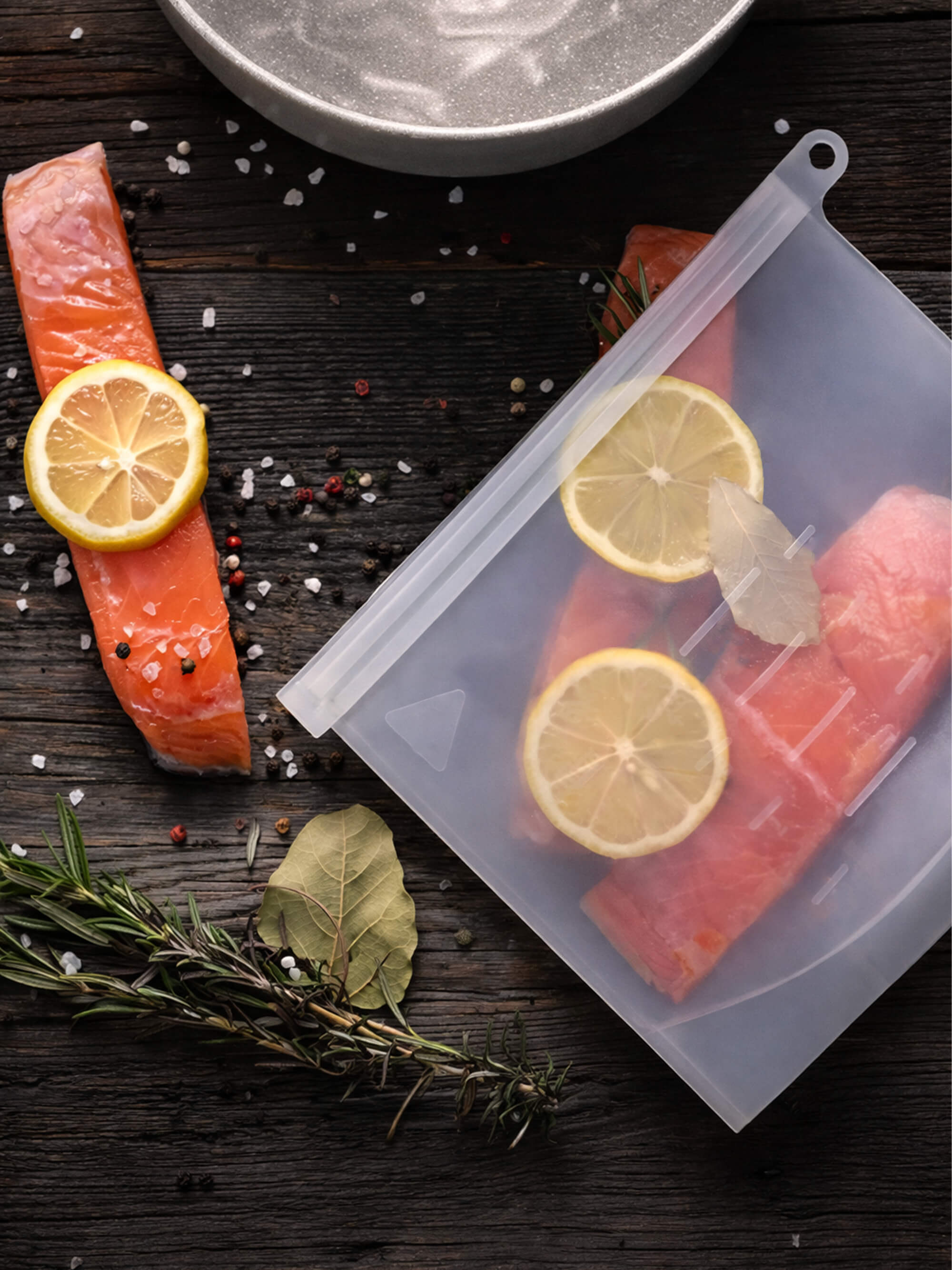 Reusable silicone freezer bag storing fresh salmon and vegetables